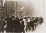 Jews captured during the Warsaw ghetto uprising are marched to the Umschlagplatz for deportation.