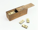 A wooden box of dominoes given to Olga Kirschenbaum as a St.
