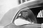 Herman Goering is driven away in an automobile following his capture.
