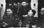 SS officers gather for drinks in a hunting lodge.