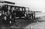 Members of the SS Helferinnen (female auxiliaries) arrive by bus at Solahuette, the SS retreat near Auschwitz.