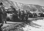 A line of German tanks from the "Prinz Eugen" Division stop on a road in snow covered Bosnia.