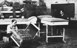 Prisoners upholster furniture at a Slovak labor camp.