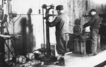 Prisoners work in a machine shop at a Slovak labor camp.