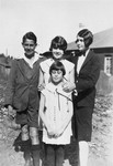 Four Jewish children pose outside their home in South Africa.
