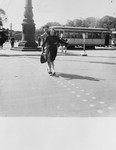 Edith Piaf (front) and Sadie Rigal (a Jewish dancer in hiding) dance across a street while on tour in Germany.