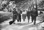 A group of Hungarian-Jewish friends, one of who was on forlough from a labor battalion, go for a walk in a park in Budpest.