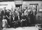 Jewish displaced persons pose outside the central administrative building in the Neu Freimann displaced persons' camp.