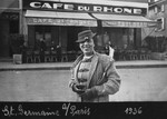 Kaethe Heksch Salomon, a German-Jewish woman, stands outside a cafe in Paris.
