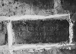 Prisoner name scratched on the wall of the Breendonck internment camp.