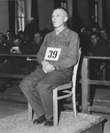 Defendant Otto Schulz sits at the dock during the Dachau war crimes trial.