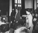 A prosecution witness points out defendant Emil Erwin Mahl during the Dachau war crimes trial.