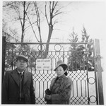Chiune Sugihara and his wife Yukiko pose in front of the gate to a park in Prague.