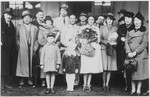 Chiune Sugihara poses with a group of people at the railroad station in Kaunas on the occasion of the departure of Polish army lieutenant Stanislaw Kaspcik and his wife, Stella Kominskaya.