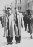 Jan Goldsztejn (left) and Markus Nowogrodzki (right) walk down a street in Vilna in 1940.