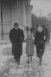 Lejb Melamdowicz on a wintertime stroll with his parents.