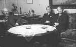 A German-Jewish family sits around a table in their home in Kassel.