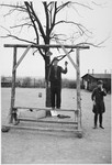A survivor shows the gallows at Buchenwald  where a prisoner was hanged before all of the other inmates when he tried to escape.