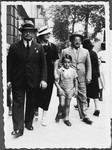 The Minerbi family walks down the streets of Warsaw.
