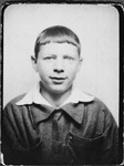 Passport photograph of Pawel Hochman (now Peretz Hochman) taken while he was living on the Aryan side of Warsaw.