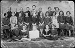 Group portrait of children and faculty in a Hebrew school in Grzymalow.