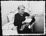 A Jewish grandmother cradles her infant grandchild.