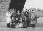 Group portrait of Red Cross volunteers and British troops near Eindhoven where they were helping refugees escaping from the German army and the front line.