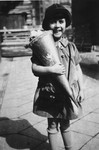 Irene Spicker holds a cone of goodies on her first day of school.