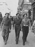 Three members of the Anders Army walk down a street probably in Italy.