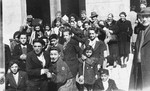 Jewish children and adults crowd into the entrance of the synagogue in Marseilles where an American Jewish chaplain is organizing Passover religious services.
