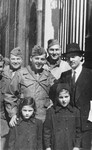 The rabbi of Marseilles poses with his daughters and Jewish-American servicemen outside the synagogue.