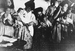 Jewish refugee women carrying infants crowd into the hull of a ship [probably the Mataroa] sailing from Marseilles to Palestine.
