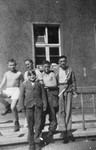 Five young survivors pose in front of a barracks in the Buchenwald concentration camp about a month after liberation.