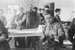 Young men study locksmithing in a vocational workshop in either the Foehrenwald or Windsheim displaced persons' camp.