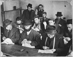 Orthodox Jewish men sew in the tailoring workshop of the Windsheim displaced persons' camp.