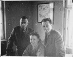 The Jewish administrator of the Windsheim displaced persons' camp (right) meets with UNRRA worker, Marion Pritchard an danother man.