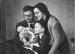 Gabriel and Victoria Avramoff pose with their son Misha and new born daughter Adela.