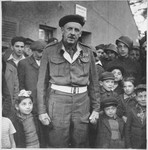 A British officer meets with children and other residents of the Foehrenwald displaced persons' camp.