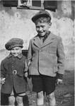 Close up portrait of a two Jewish boys holding hands in the Windsheim displaced persons' camp.