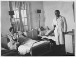 A physician visits two female patients in their room in the Shanghai Jewish hospital.