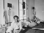 Patients sit and lie in their beds in the Shanghai Jewish hospital.