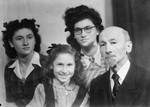 Studio portrait of a Jewish family in Metz after the war.