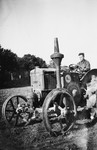 A German Jew drives a tractor in a training farm outside of Breslau.