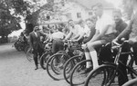 Jewish youth from a training farm outside of Breslau stand in line on bicycles before a raise or an outing.