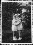 Two young Polish children embrace.

Pictured are Rita Blumstien as a young girl, with a friend.
