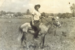 Franz Blumenstein rides a donkey in Sosua, Dominican Republic.
