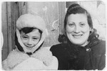 Portrait of two Jewish refugees wrapped in winter coats in the Soviet town of Kutaisi, Georgia.