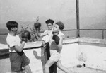 Two teenage boys spar on a balcony of the Selvino children's home in Italy.