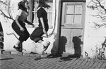 Two girls skip rope outside an international boarding school in Switzerland.