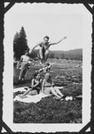 Heinz Bähr leaps over his cousin and a friend during an outing to a park in or near Freiburg.